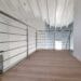 Scala a sbalzo con parapetto in acciaio inox satinato elicoidale e dritto. Tutte le parti dei tondini e corrimano sono saldati e satianti in opera.